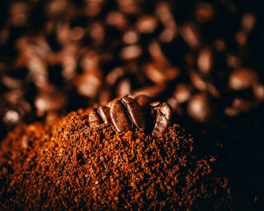 Close-up of ground coffee with whole coffee beans