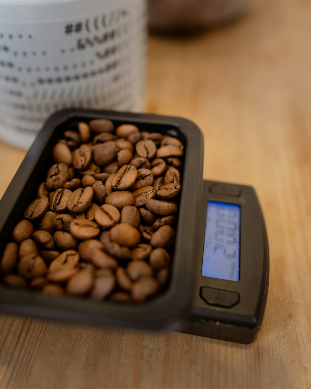 Coffee beans on digital scales, weighed out for an espresso