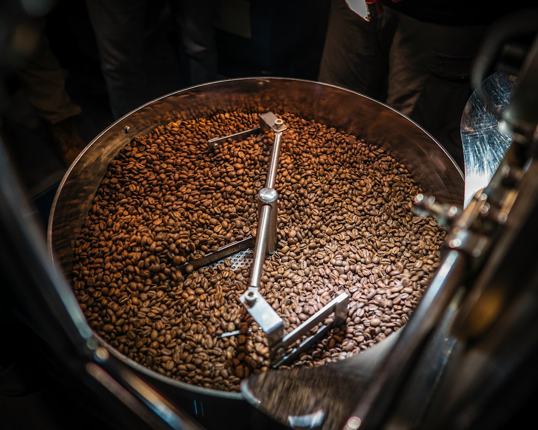 Large metal bowl full of coffee beans