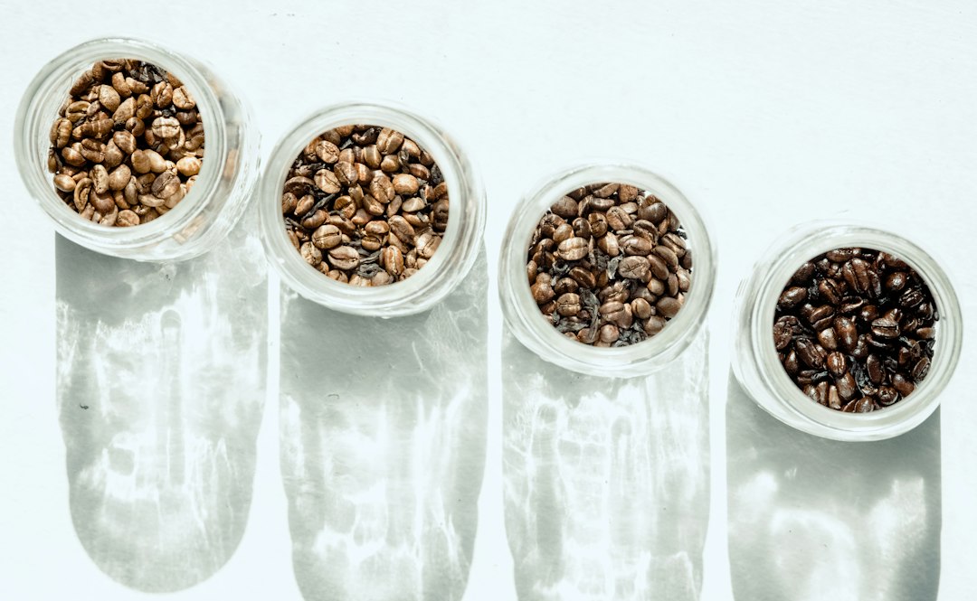 Coffee beans in different roast levels from light brown to almost black