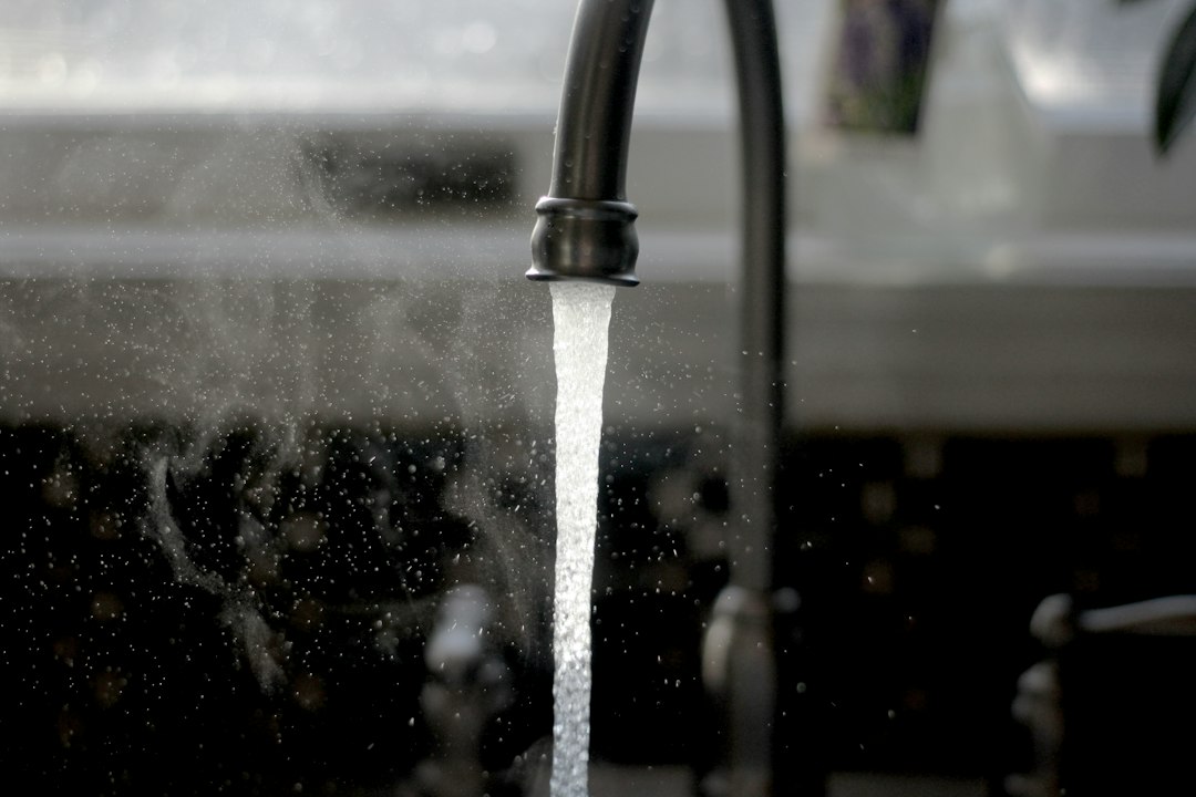 Tap water running from a kitchen tap