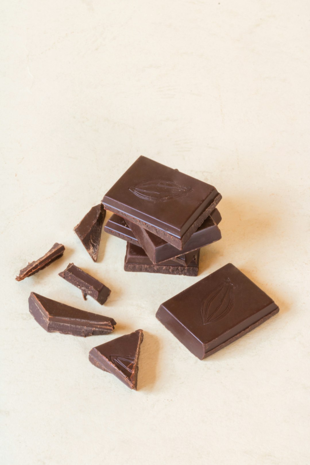 Broken pieces of dark chocolate on a table