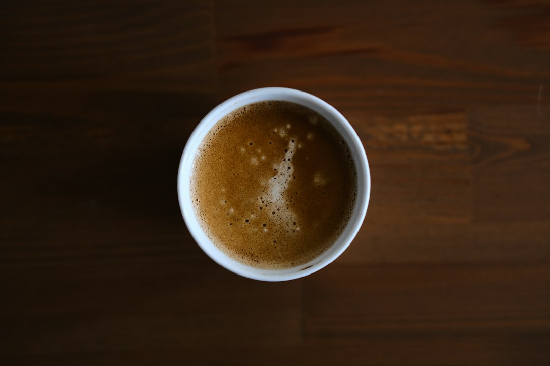 A cup of coffee on a wooden table